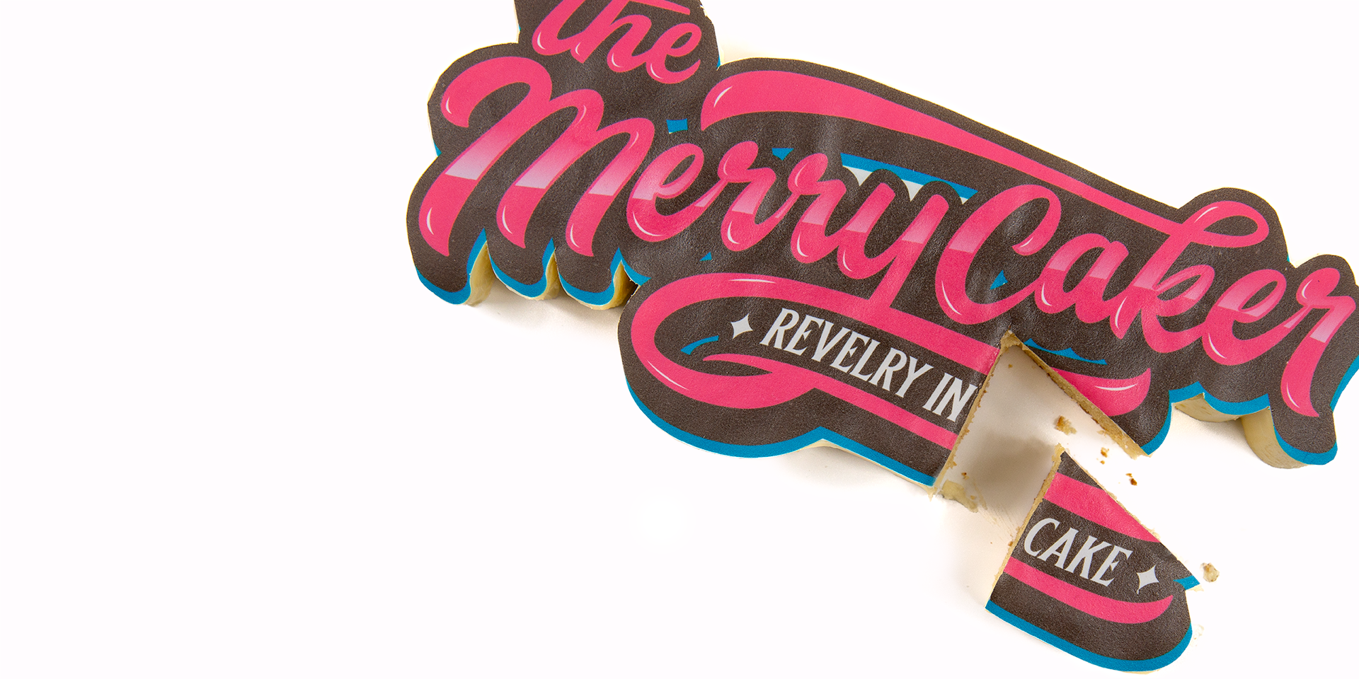 The Merrycaker logo as a real cake with a slice cut out of it