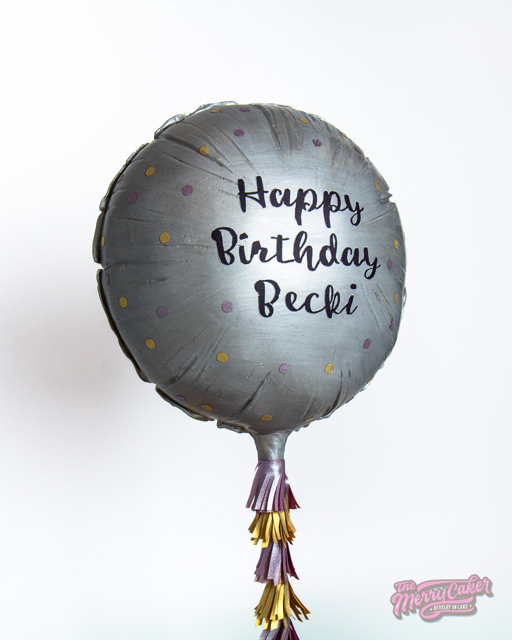 A hyper-realistic gift box present cake with an edible gift bow